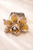 Éclat Blossom Crystal Hair Comb: amber crystal flower comb with a round bead centre on peach satin