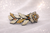 Eternal Rose Crystal Barrette: amber/champagne-stone leaf-and-rose barrette on pale sparkly backdrop, landscape frame