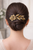 Eternal Rose Crystal Barrette worn in hair: back view of a person with dark hair in a low bun