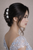 Lumière Oval Crystal Hair Stick worn in hair: woman in profile, dark hair, three clear oval pins in updo