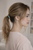 Petite Bloom Crystal Ponytail Holder worn in hair: profile of a woman