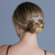 Floral Arc Crystal Hair Barrette: floral crystal barrette worn in a blonde bun, seen from behind