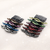 Éclat Interwoven Crystal Hair Comb: small interwoven combs with crystals in assorted colours on shimmering cream fabric