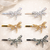 Auréline Dragonfly Crystal Magnetic Barrette: six of the colours on a pink sparkle background