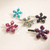 Petal Spark Crystal Magnetic Barrette colour range: five flower slide clips in teal, clear, black, pink, and purple/plum