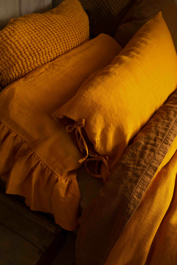 Turmeric linen pillow stacks, retro vintage aesthetic