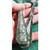 The effect the dirty down green paints when applied to a knife and fork as part of a demonstration of the green paint