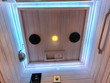 Look up and unwind. Dual ceiling speakers, chromotherapy lighting, and a warm reading light set the perfect atmosphere for every session.