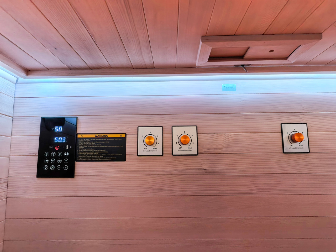 Full command, right in front of you. The Vista Trio's control wall features a digital touch panel, three independent infrared intensity dials, and chromotherapy lighting — everything you need to dial in the perfect group session.
