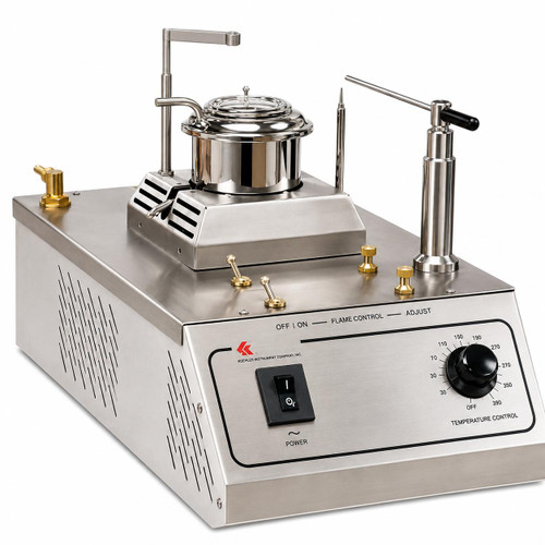 Gilson Company Tag Open Cup Apparatus for Bitumen Testing, laboratory equipment for testing the properties of bitumen with a stainless steel design, temperature control dial, and various knobs and attachments.