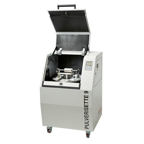 Fritsch Vibrating Cup Mill, industrial laboratory equipment with open lid revealing the internal grinding mechanism and digital control panel.