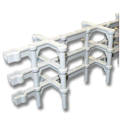 Polylok Slab Bolster, 44in x 3in Cover stackable product, white plastic slab supports arranged in a stepped pattern, used for construction or landscaping, shipped in a skid, 22 cases with 72 per case.