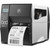 Zebra ZT230 QR Code Scanner and Label Printer Kit, industrial-grade thermal label printer printing a barcode or shipping label.