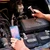 FLIR ONE Edge Pro Wireless Thermal Camera, person using the thermal camera to inspect a car engine.