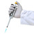 Oxford Lab Products Oxford Accupet Pro Single Channel Pipette, 0.5 to 10 Microliters, being held by a gloved hand.
