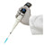 Oxford Lab Products Oxford BenchMate Electronic Pipette, 50 to 1000 Microliters, being held by a gloved hand, used for precise liquid measurement in laboratory settings.