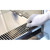 Lab Companion JB-12A Biosafety Cabinet, Class II A2, 452 Exhaust Volume image showing a hand in a glove adjusting a vent on a stainless steel biosafety cabinet.