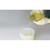 Lab Companion Handle Beaker, PMP (Transparent), 1000ml with 20ml Graduations, being used to pour yellow liquid, in a laboratory setting.