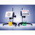 Anton Paar ViscoQC 300 H Rotational Viscometer, two laboratory devices measuring viscosity of yellow and green liquids in glass beakers.