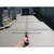 Slip Industries Torpedo Groover, 72 inches length with 1-3/8 inch depth cut, used for precise groove cutting on concrete surface in outdoor construction.