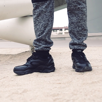 Close up of man walking on sand wearing Men's Lace Walking Shoe Black