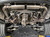 Top Speed Pro1 Porsche 997.2 Turbo, Turbo S, GT2 & GT2 RS 2010-2013 T304 stainless steel rear exhaust system kit with polished mufflers, mandrel-bent piping, clamps, mounting hardware, and direct bolt-on components.