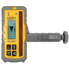 Spectra Precision HL760 laser receiver mounted on its rod bracket, showing the on-grade arrow display and the millimetre and inch numeric readout
