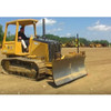 Crawler dozer grading a jobsite with a machine receiver mast on its blade