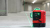 Leica Lino L6G green multi-line laser on a concrete floor with three crisp green 360 degree laser lines