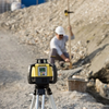Leica Rugby 680 dual grade laser set up on a jobsite