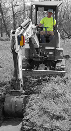 Spectra CR700 magnet-mounted on an excavator checking depth in a ditch