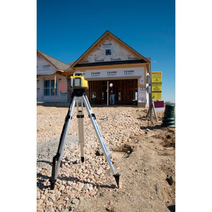 Spectra LL300N rotary laser set up on a tripod at a residential framing jobsite