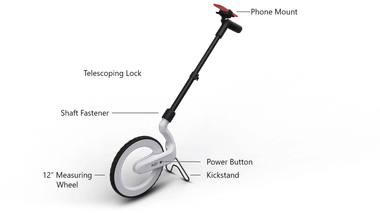 Plott Carta digital measuring wheel parts diagram with labeled callouts: phone mount, telescoping lock shaft fastener, 12-inch measuring wheel, power button, kickstand