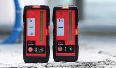 Leica RGR 300-D digital line laser receiver standing beside the Leica RGR 200 acoustic line laser receiver