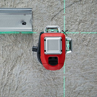 Leica Lino L6G aimed up at a ceiling rail with the green plumb point crossing on the surface