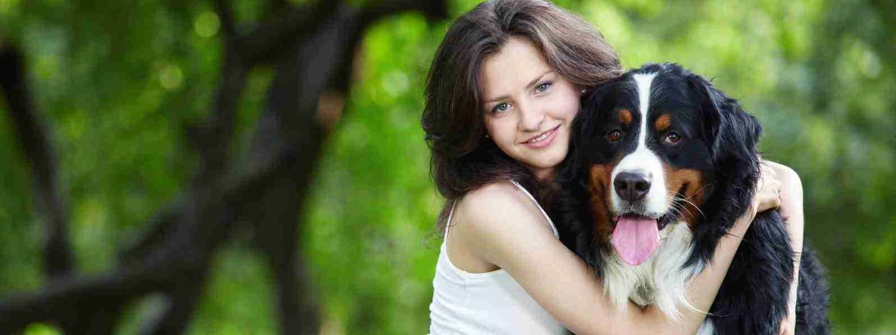 Lady hugging dog