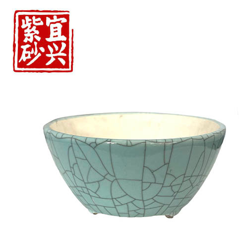 Round, turquoise glazed pot