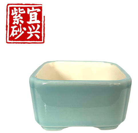 Pale turquoise glazed square pot
