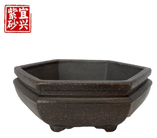Hexagonal pot with strong indents near the top