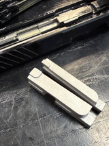 Replace the factory polymer striker block with a stainless steel striker block that permanently eliminates TX22 striker face cracking caused by forced reset triggers. Proven in 10,000+ round torture tests, this replacement striker block prevents FRT-induced damage and ensures reliable rapid-fire performance. rate reducer