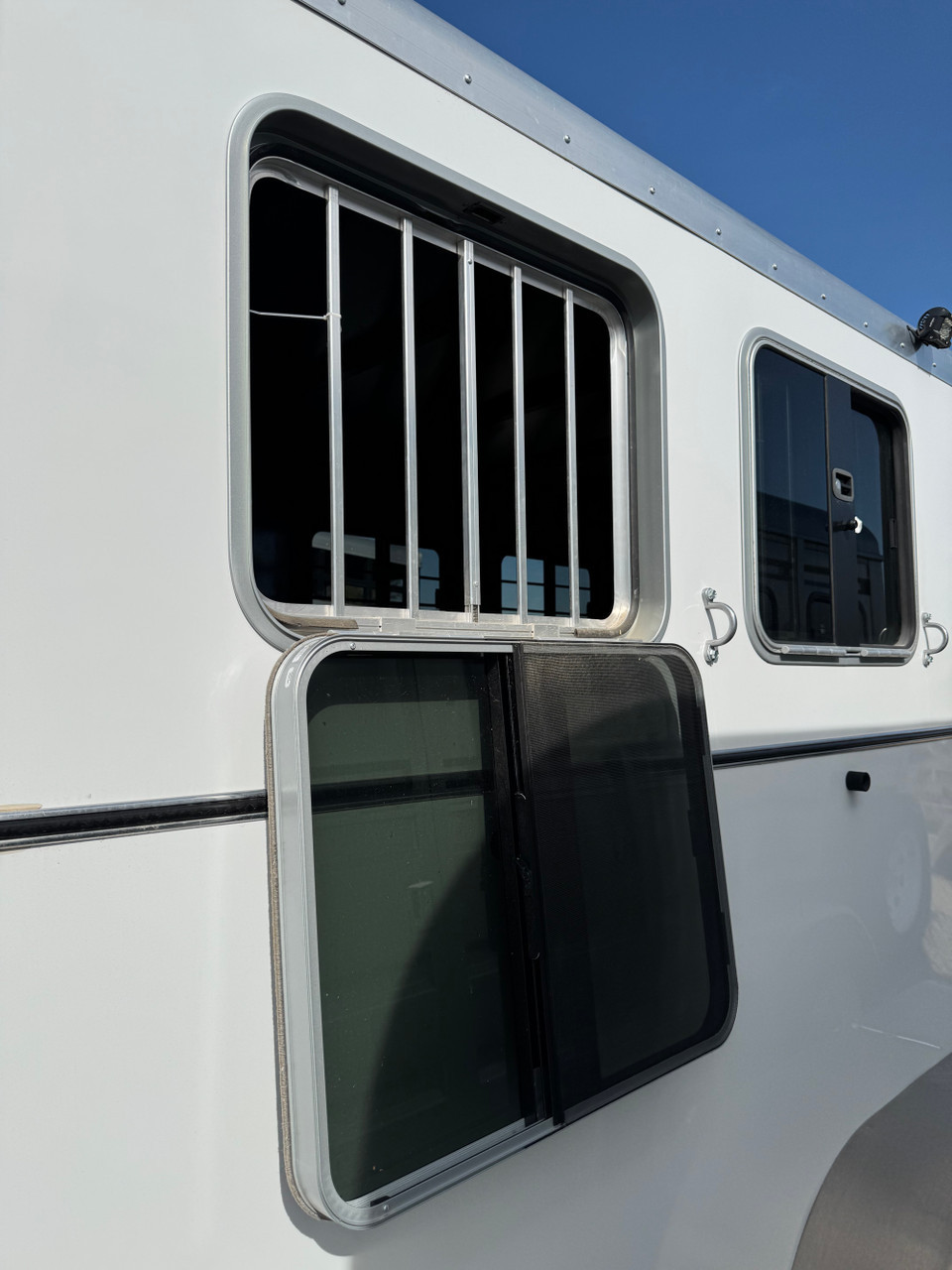 Triple C Trailers 2023 Teton Horse Trailer | 2H, SWING-OUT SADDLE RACK, DOOR ORGANIZER, EXT LOAD LIGHTS, WINDOWS, SPARE (charmac logo)