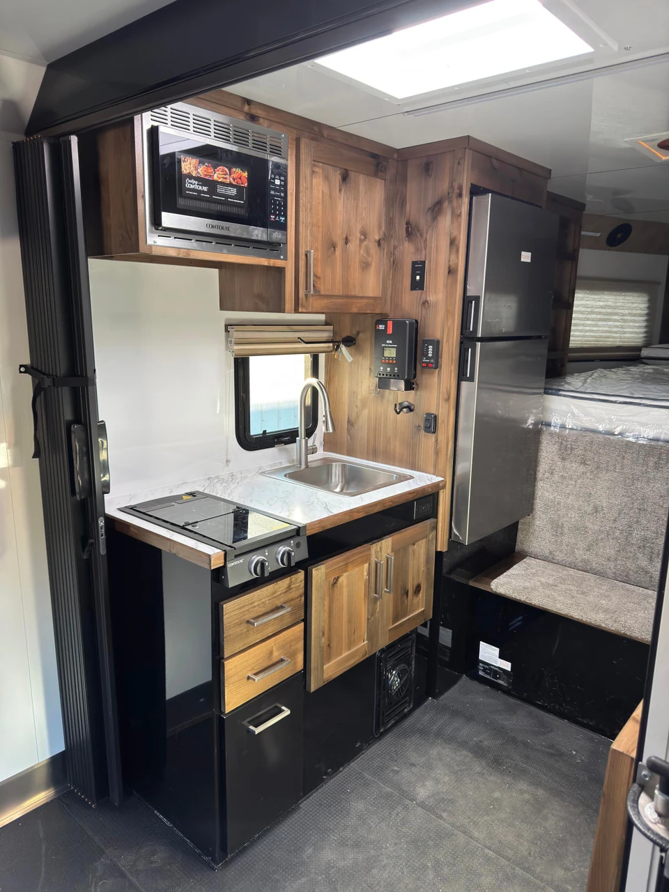 Trails West Trailers 2027 RPM Freeride 24' Powersport Trailer | Tandem Axle, AC, AUX PROPANE, BOOT DRYER, CAR TIE DOWNS, DAY-NIGHT SHADES, 3 EXTRA INT LIGHTS, QUAD 6 VOLT BATTERY, FLOOR INSULATED, FUEL CELL (30 GALLON), GLASS SHOWER DOOR, INVERTER 20