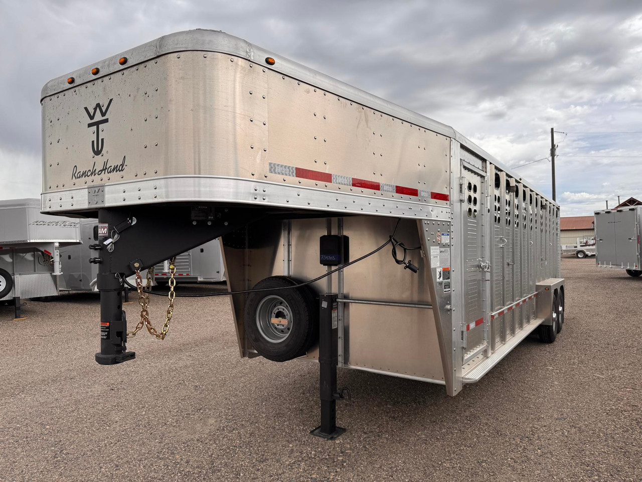 Wilson Trailers 2027 Punchside 84"X24' Stock Trailer | Tandem Axle 16K, Tie Loops Inside and out, Running Boards
