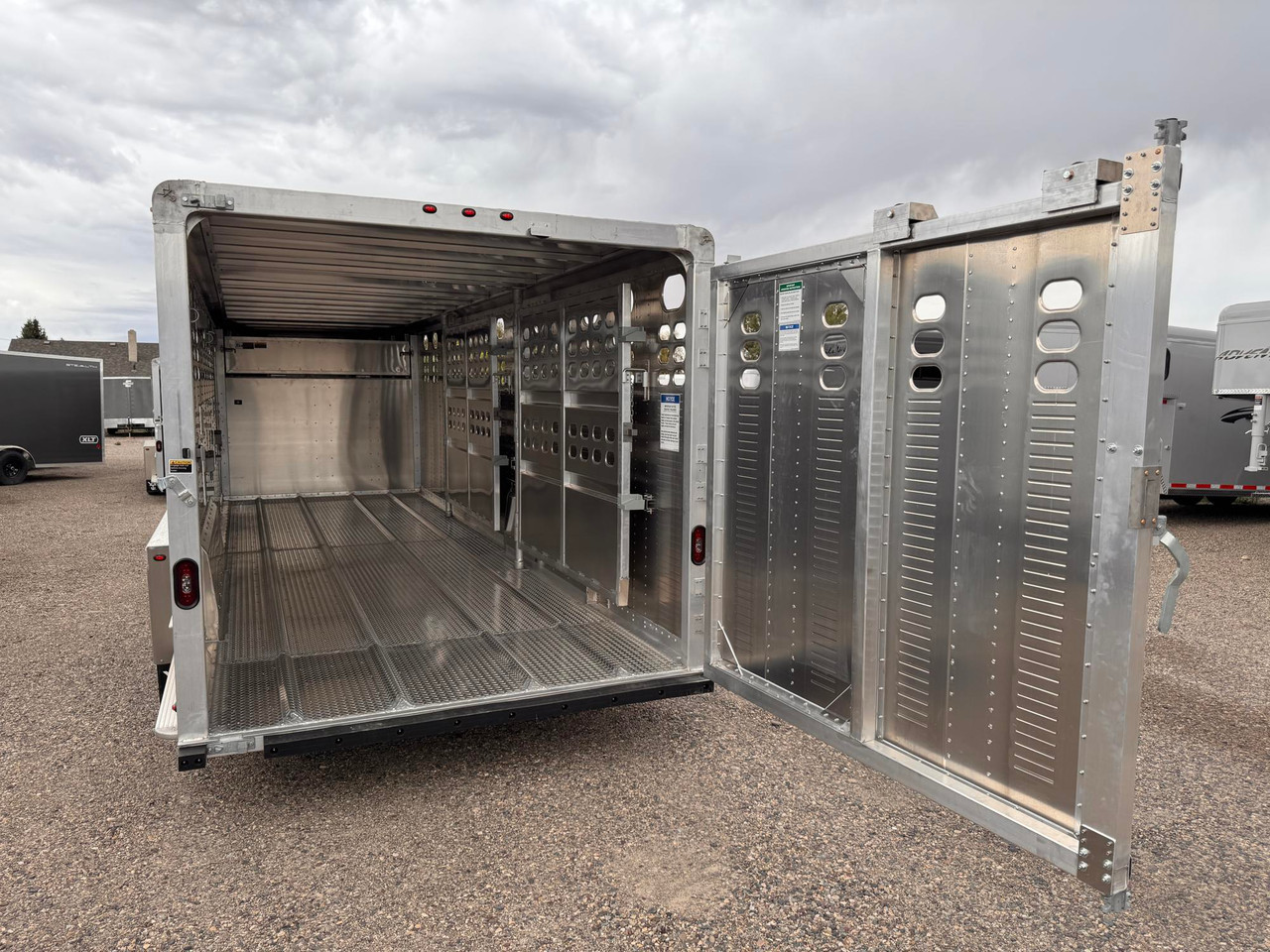Wilson Trailers 2027 Punchside 84"X24' Stock Trailer | Tandem Axle 16K, Tie Loops Inside and out, Running Boards