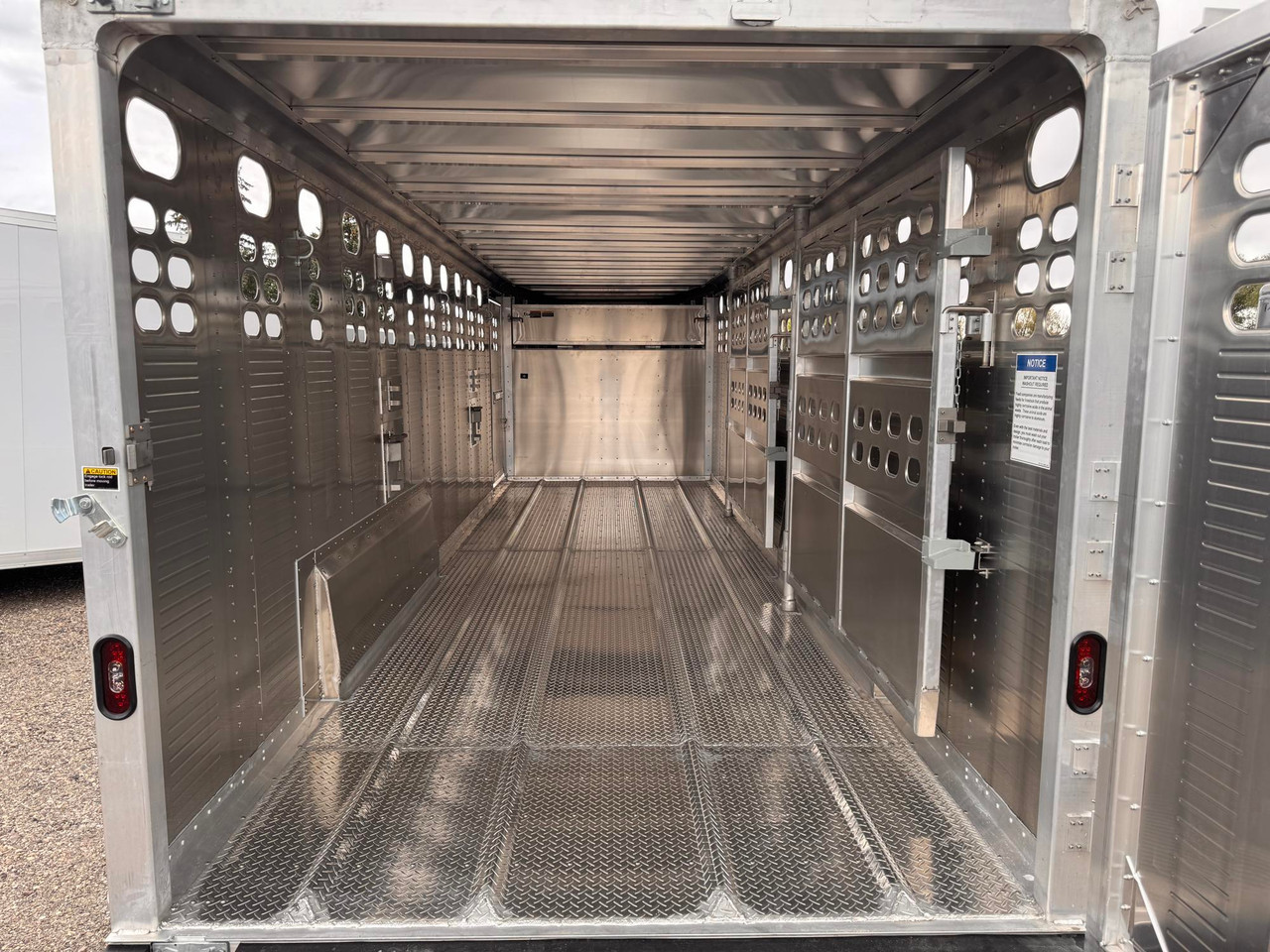 Wilson Trailers 2027 Punchside 84"X24' Stock Trailer | Tandem Axle 16K, Tie Loops Inside and out, Running Boards
