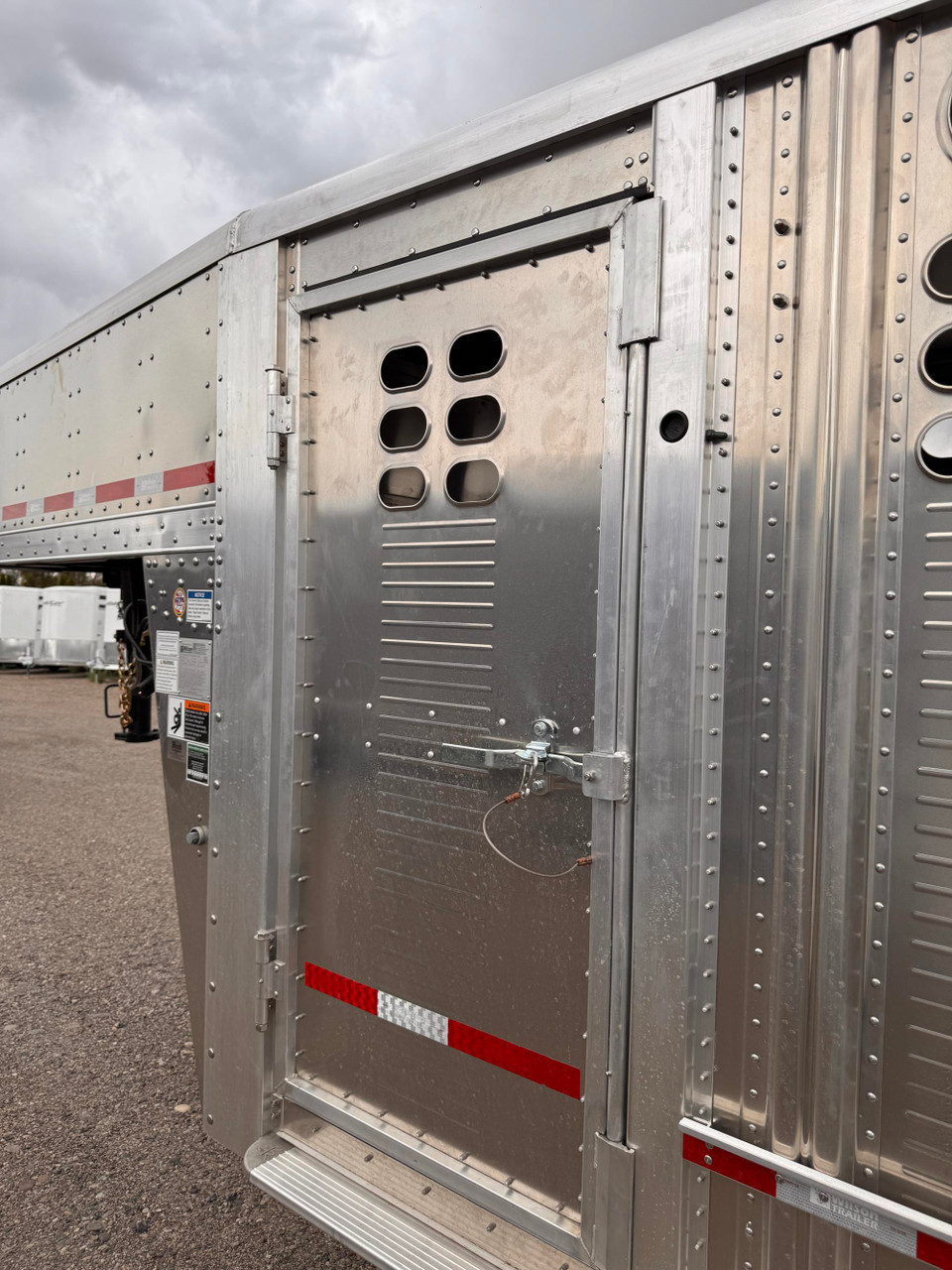 Wilson Trailers 2027 Punchside 84"X24' Stock Trailer | Tandem Axle 16K, Tie Loops Inside and out, Running Boards