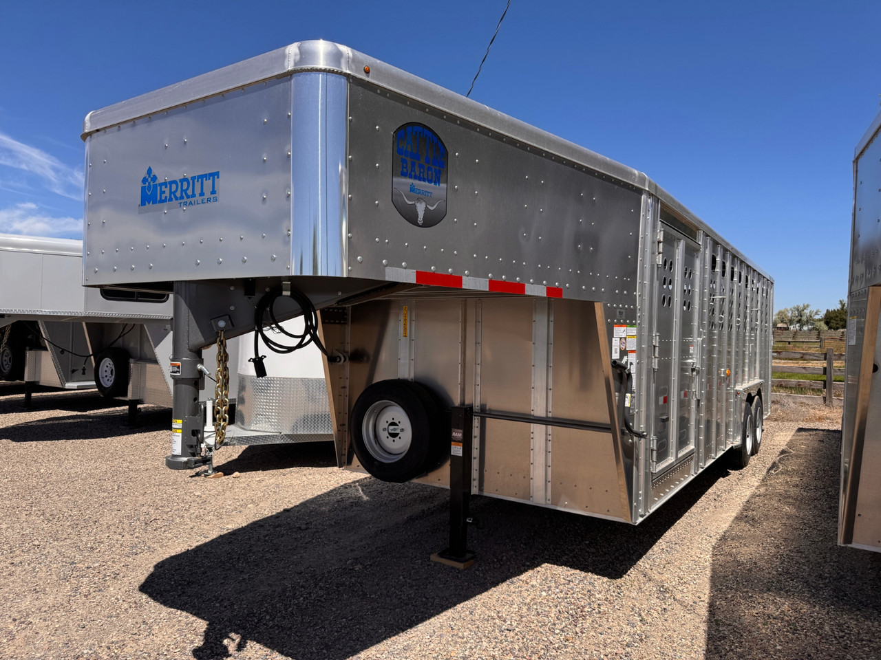 Merritt Trailers 2026 PUNCHSIDE 96"X24' Stock Trailer | Tandem Axle 17K, Aluminum, 52" Driver Escape Door, 2 Center Gates, Spare Tire Mount and Spare Tire