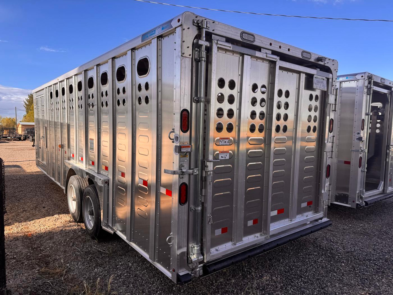 Merritt Trailers 2026 PUNCHSIDE 96"X24' Stock Trailer | Tandem Axle 17K, Aluminum, 52" Driver Escape Door, 2 Center Gates, Spare Tire Mount and Spare Tire