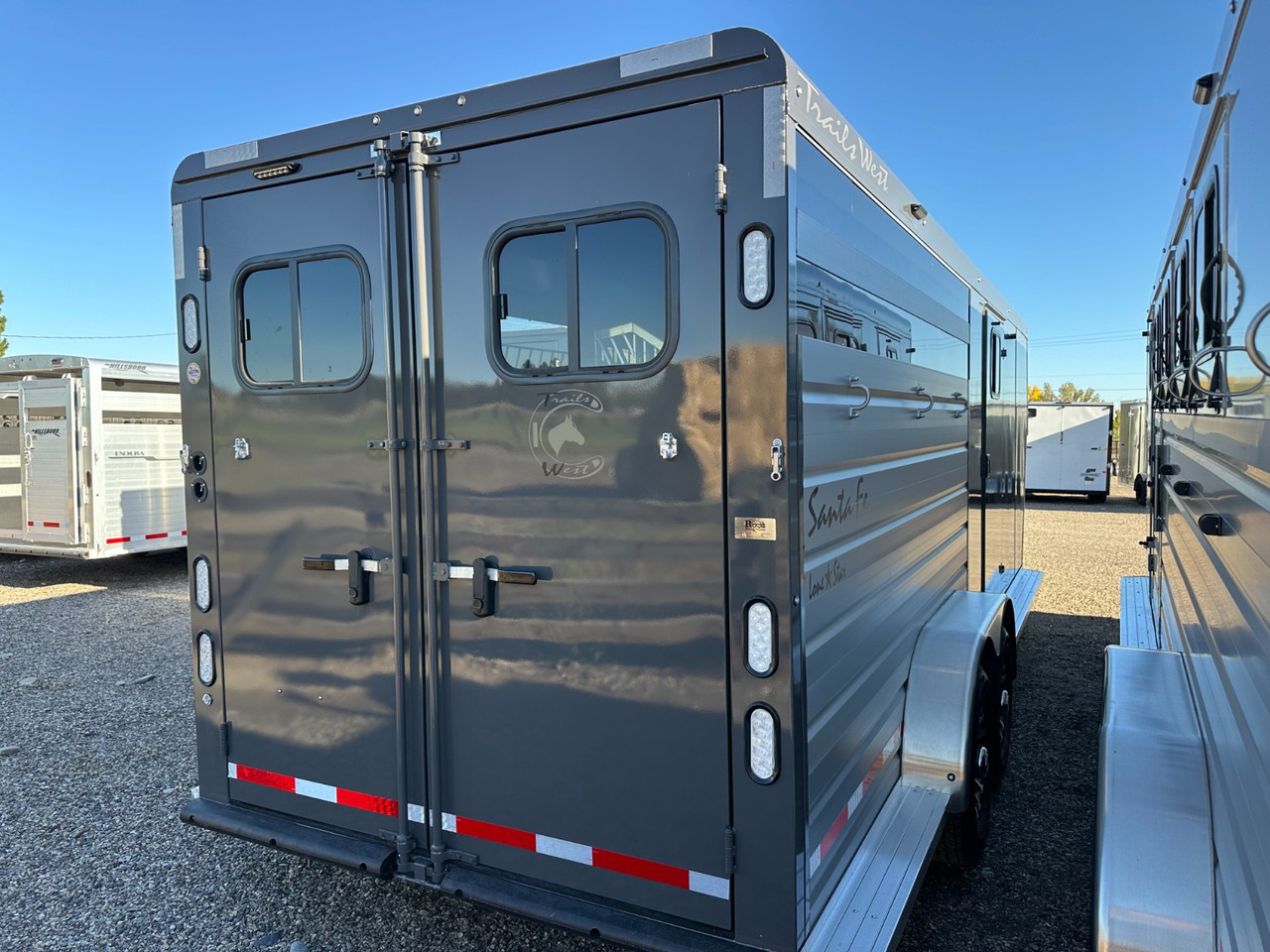 Trails West Trailers 2026 SANTA FE SUPER TACK Horse Trailer | Tandem Axle, Lonestar Package, Plexiglass, Barn Doors, Rubber Floors, Swing Out Saddle Racks, Tongue Storage