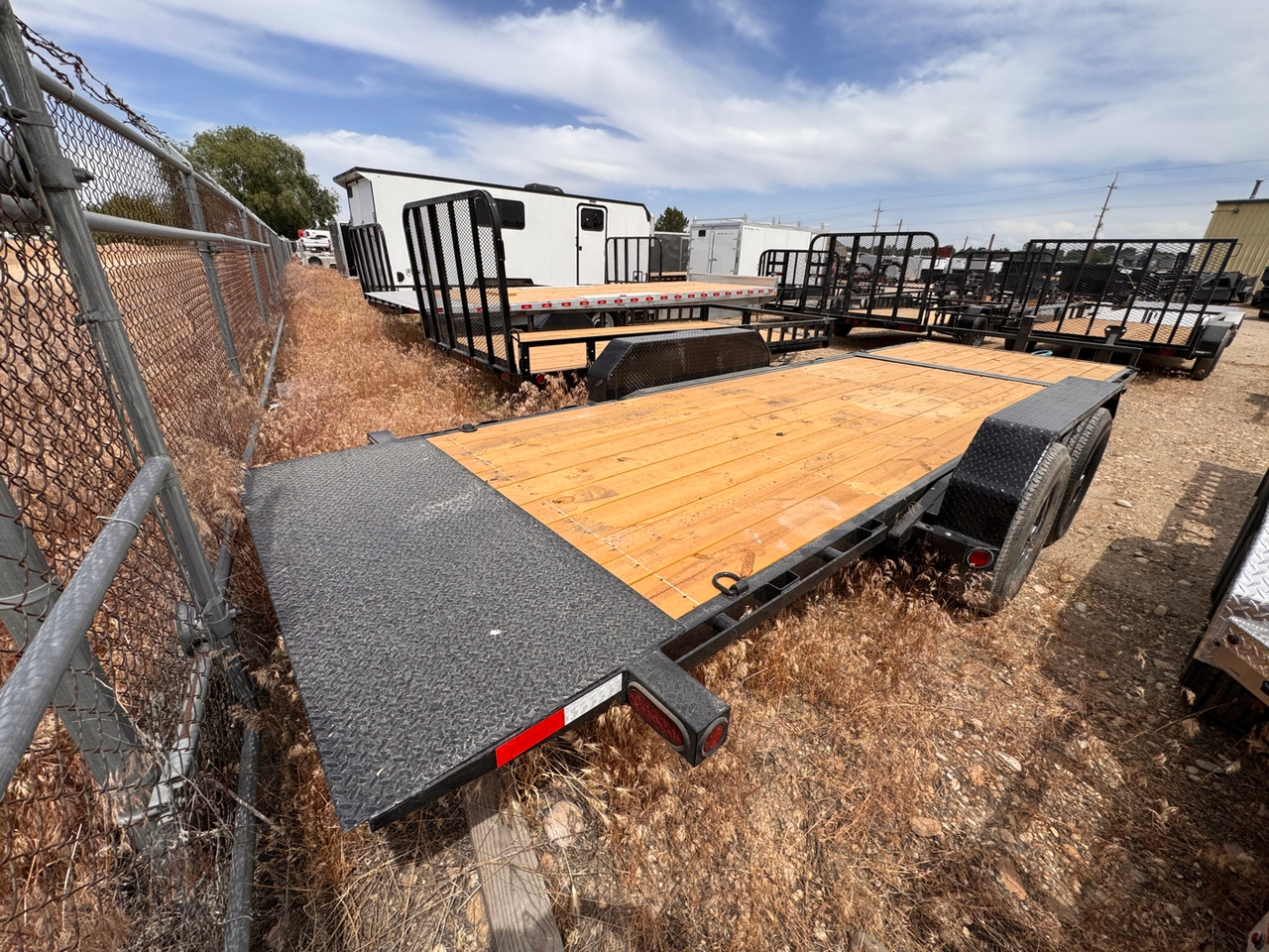 P.J. Trailers 2027 T6 22' Equipment Tilt Trailer | Tandem Axle 14K, Lid Over Tongue, Fork Holders
